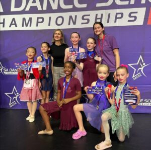 Orlovska Dance Academy students and teachers celebrating their medal haul at the SA Dance School Championships.